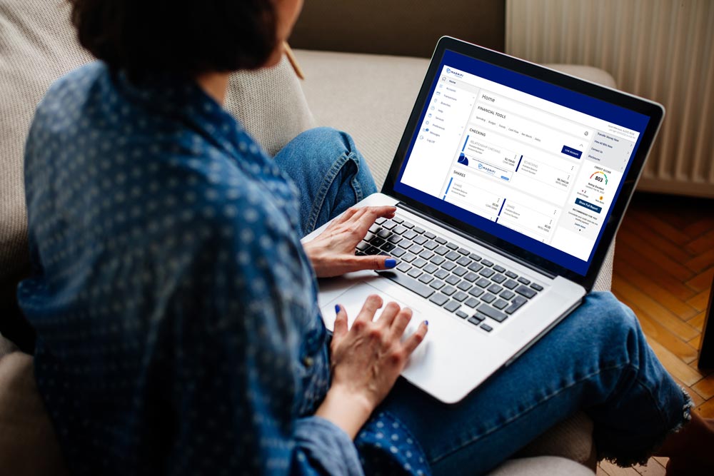 woman reviewing digital banking on laptop