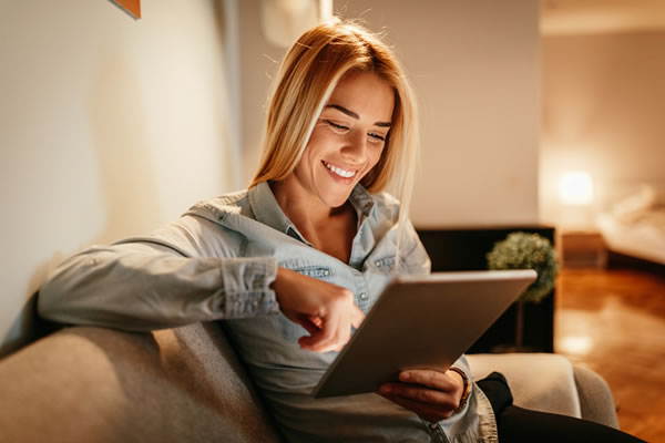 woman looking at a tablet